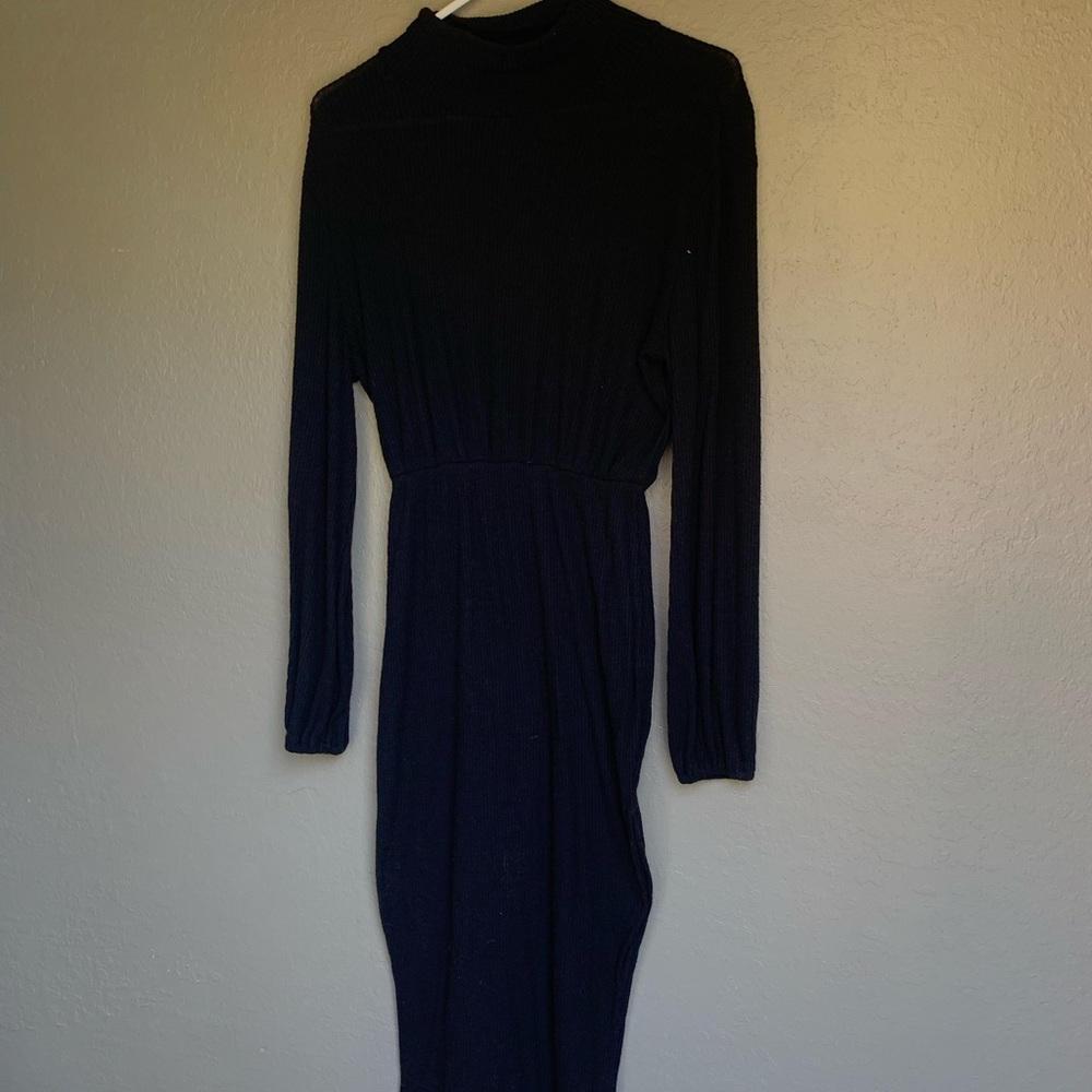 Black long sleeve turtleneck with side slit on leg